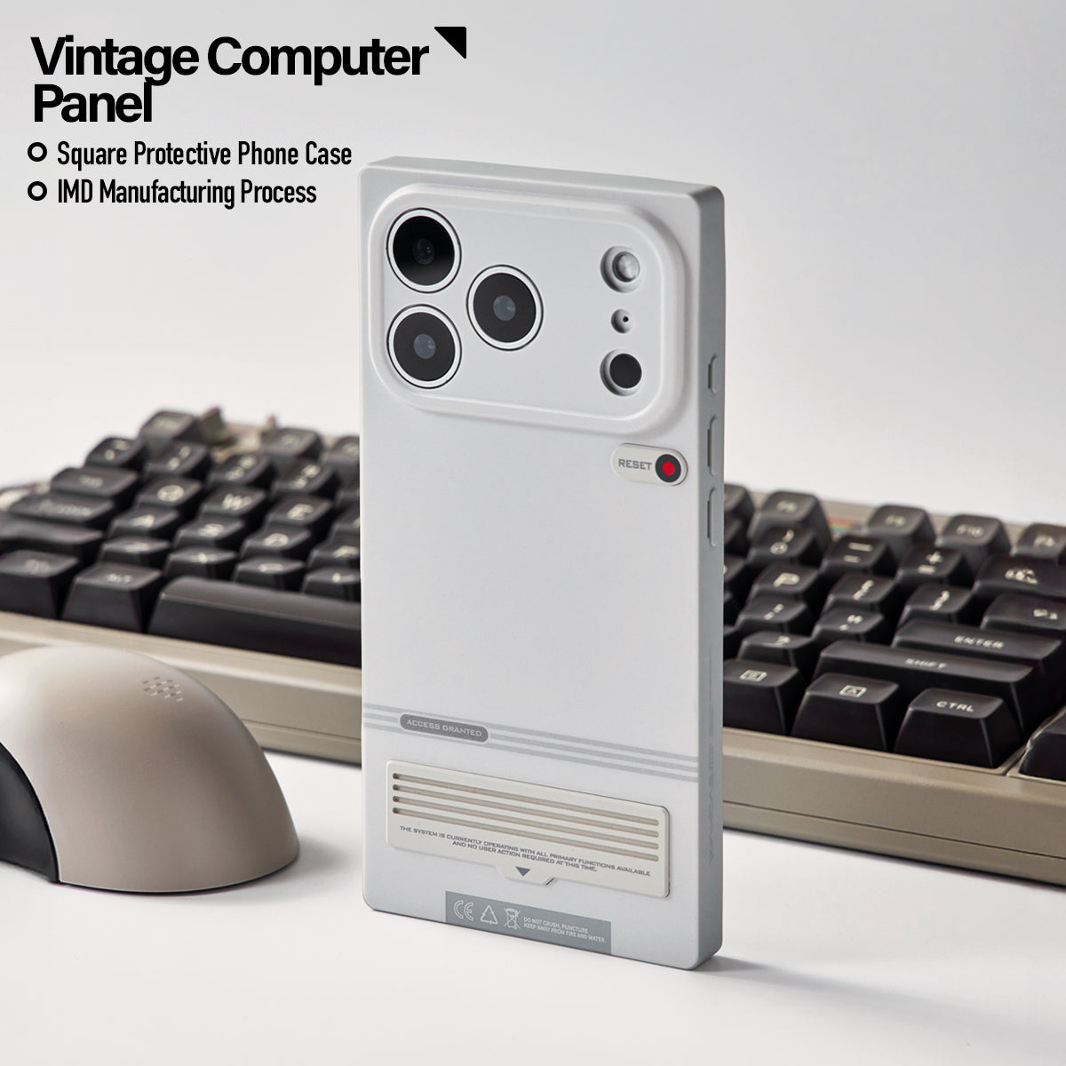 Retro terminal case beside a keyboard and mouse