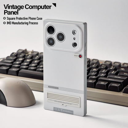 Retro terminal case beside a keyboard and mouse