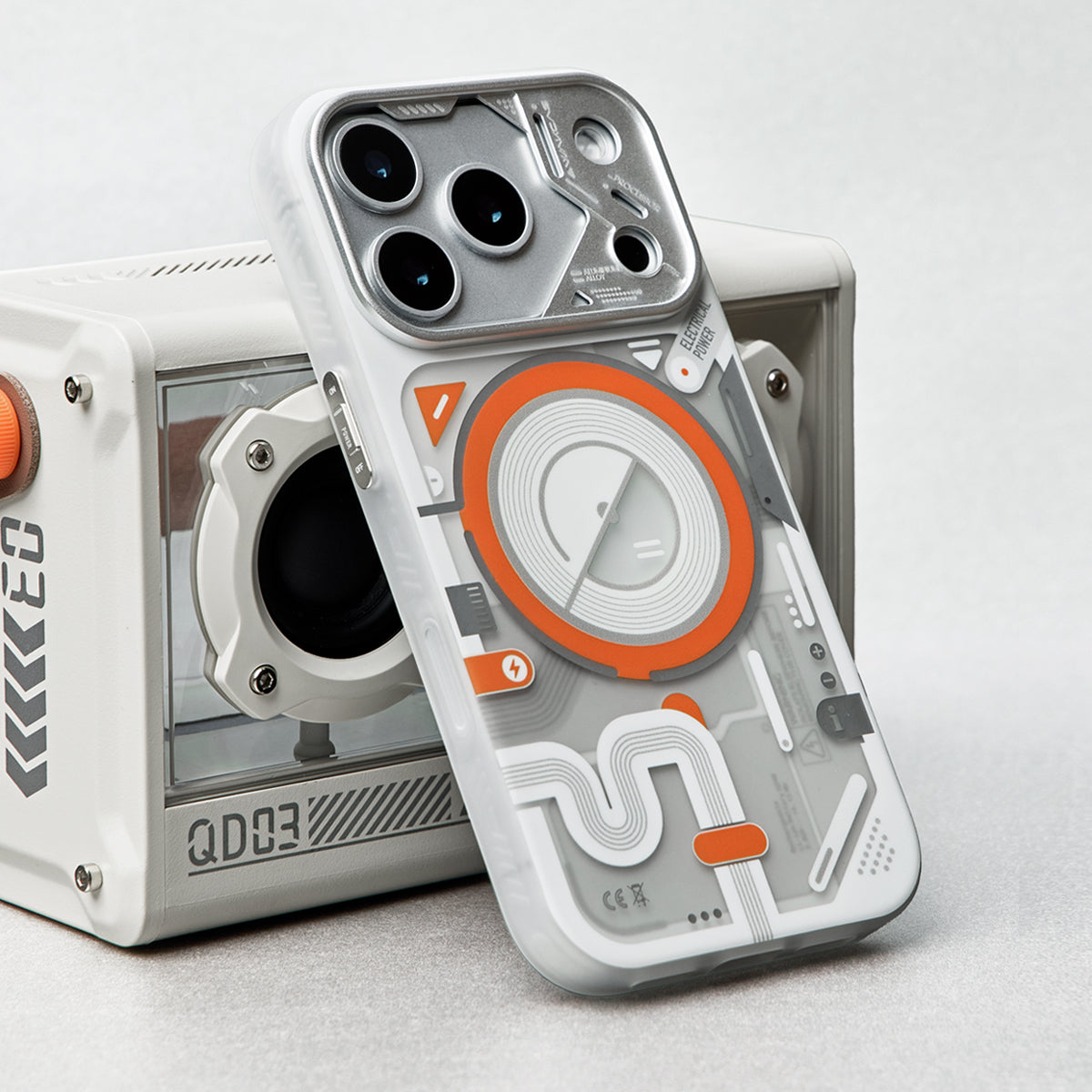 White and orange case leaning on a retro speaker