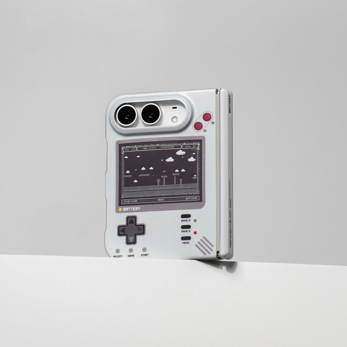 iPhone Duo in the retro console case standing upright against a gray wall