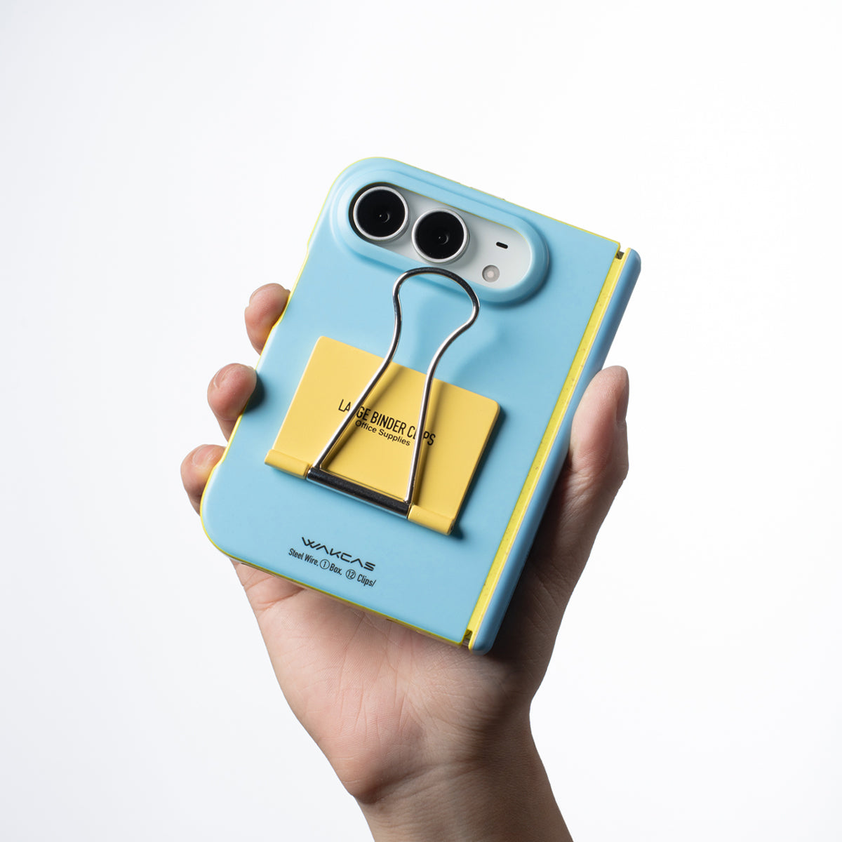 Hand holding an iPhone Duo in the Blue file folder case