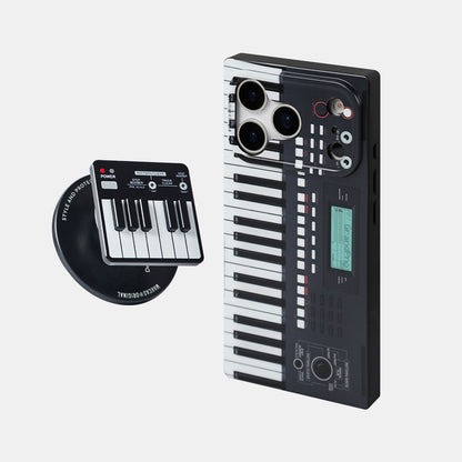 Black piano-key case next to the piano-shaped magnetic stand