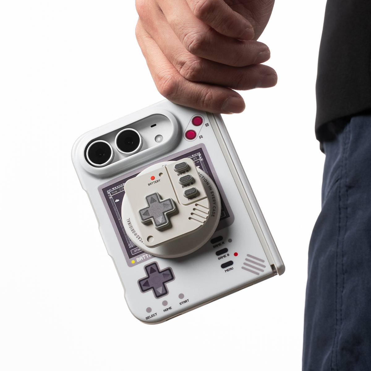 iPhone Duo in the retro console case with the controller stand attached, held by a hand