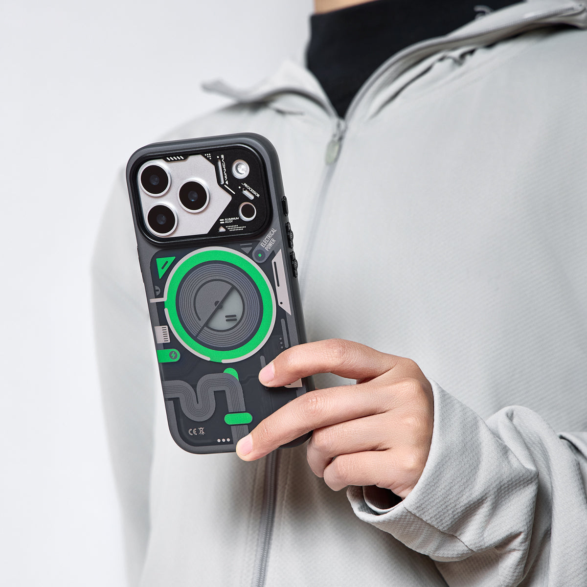 Person holding the black and green case