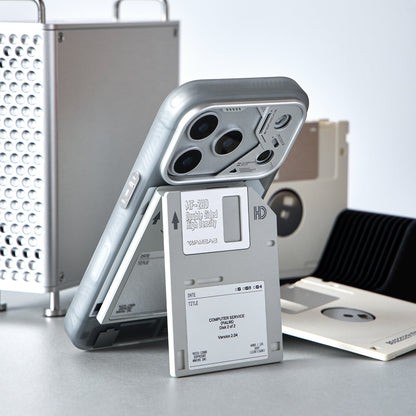 iPhone standing upright on the opened floppy disk stand