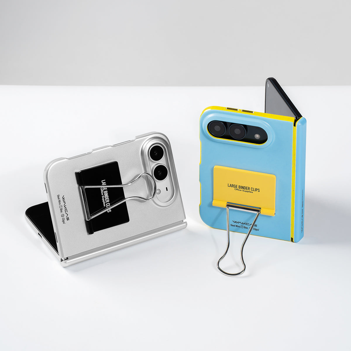 Silver and Blue file folder cases standing upright on a white table