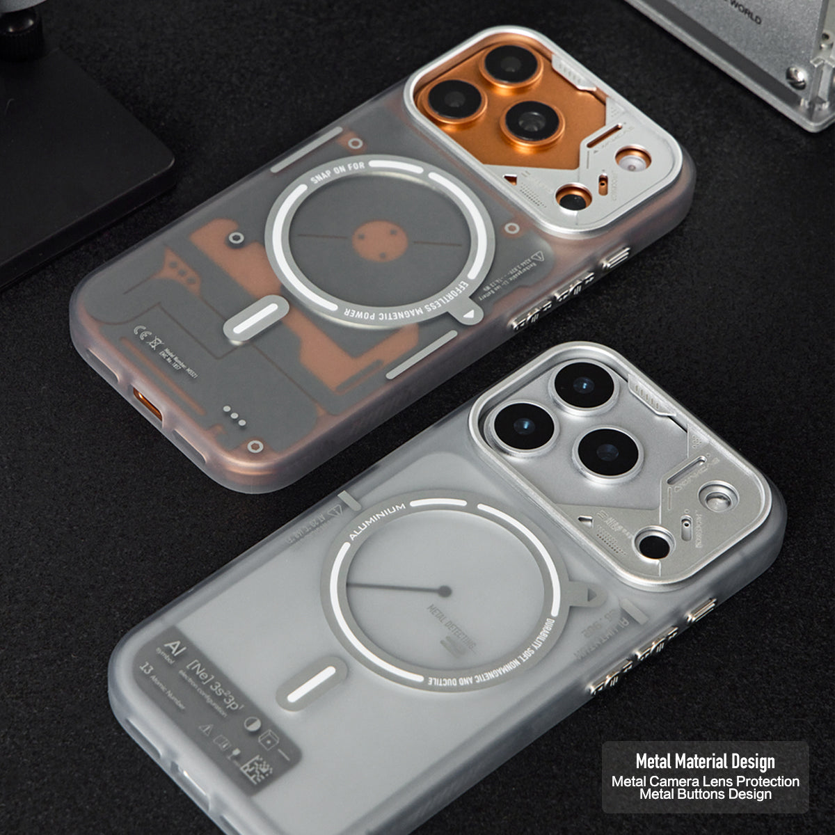 Frosted cases with orange and silver camera frames laid on a dark surface