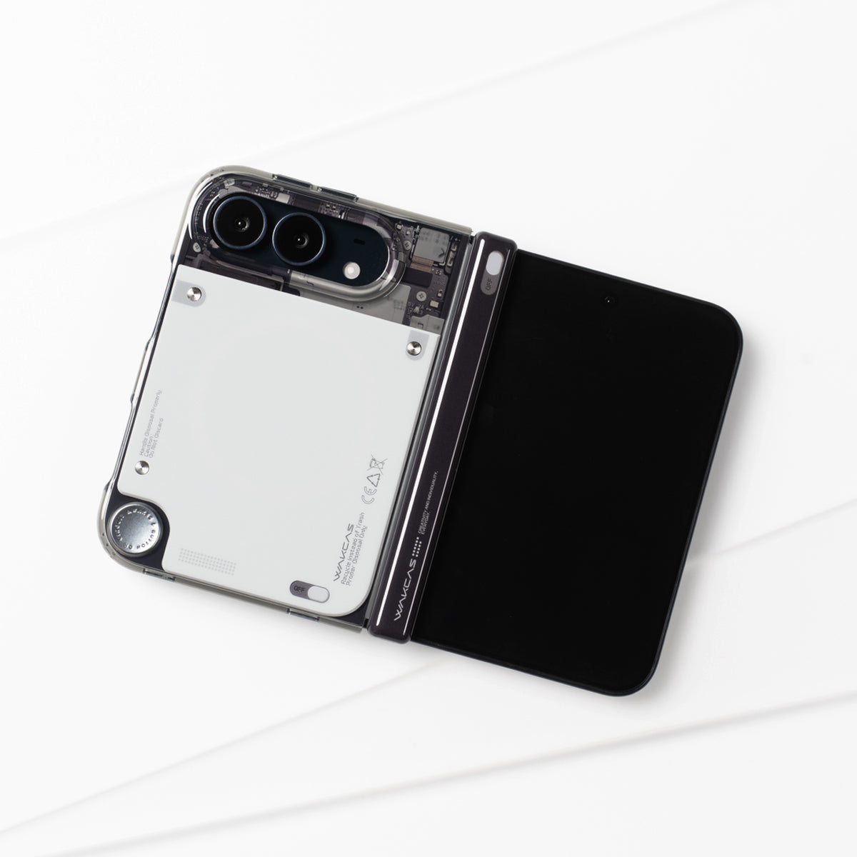 Unfolded iPhone Duo in the gloss see-through case lying on a white surface