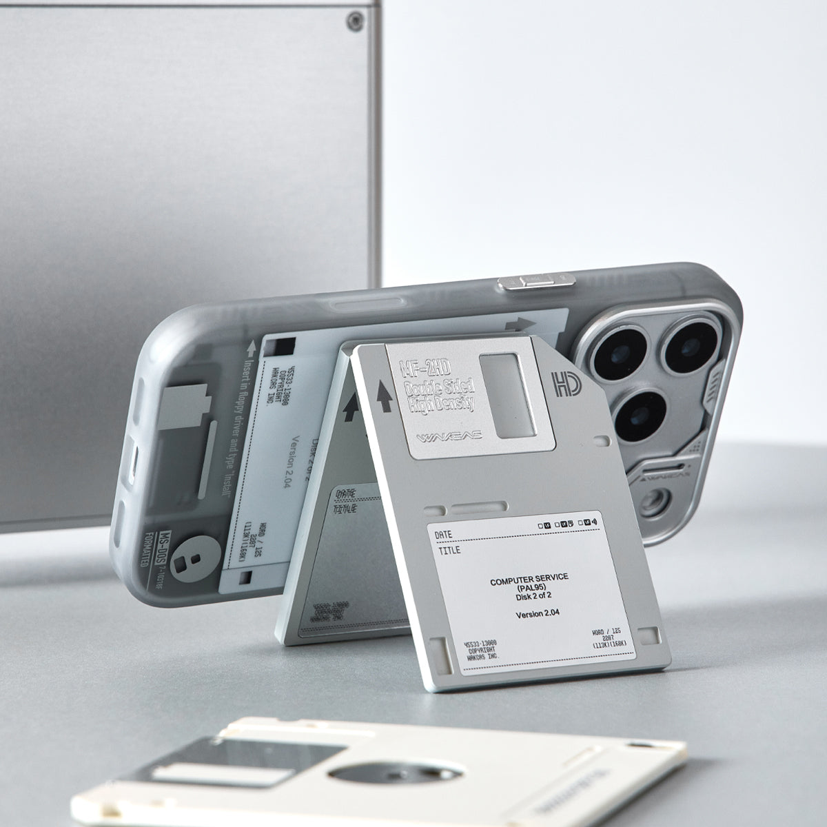 iPhone propped in landscape on the floppy disk magnetic stand