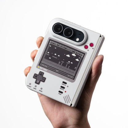 Hand holding an iPhone Duo in the gray retro handheld console case