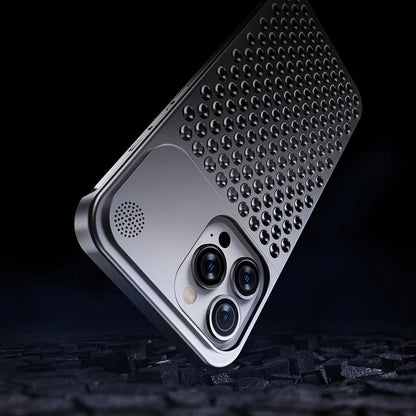 Silver perforated aluminum iPhone case angled to show camera cutout