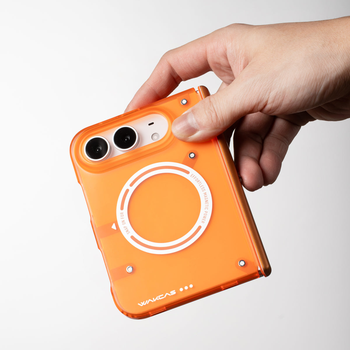 Hand gripping an iPhone Duo in the Transparent Orange case from the top