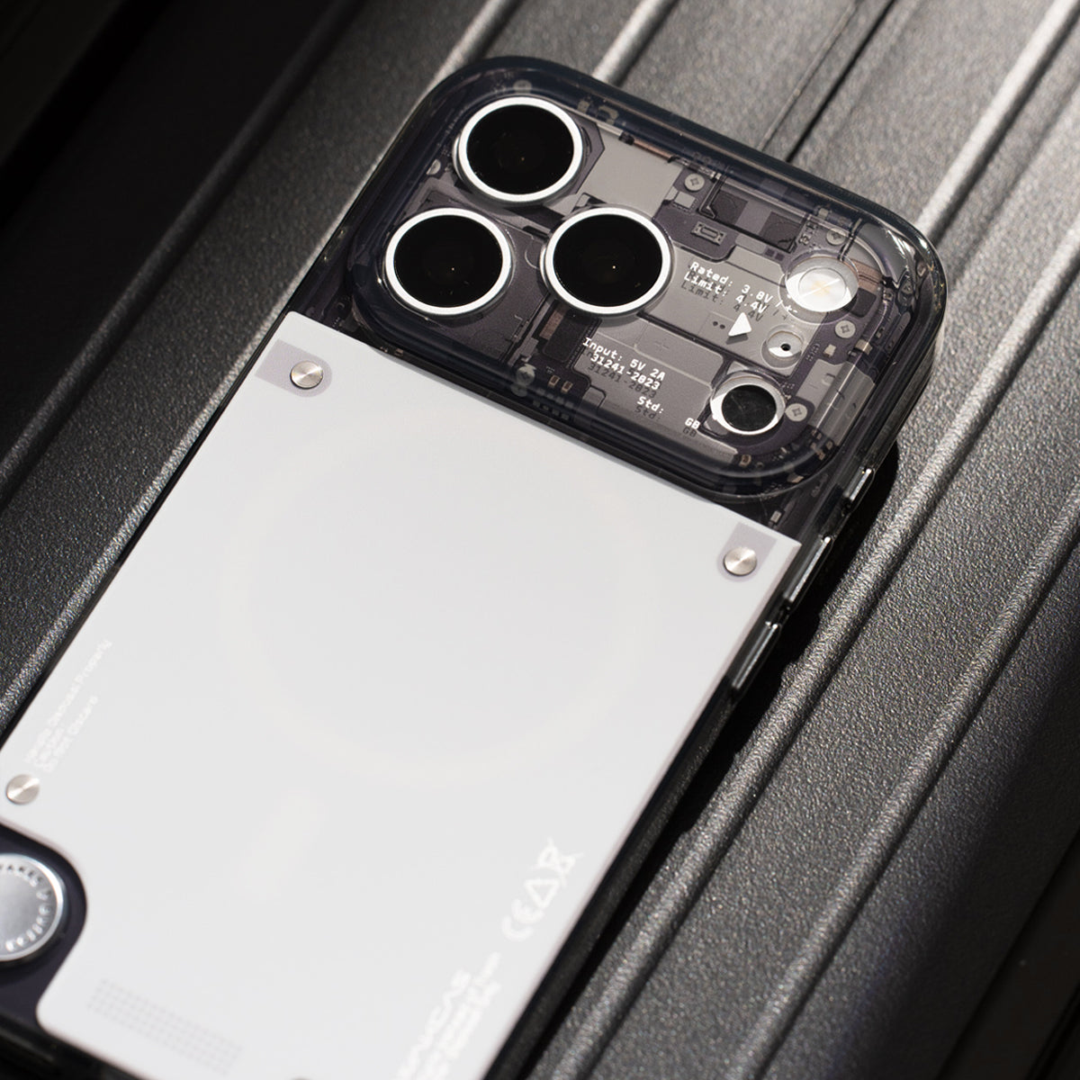 Close-up of camera lens cutouts on gloss see-through iPhone case