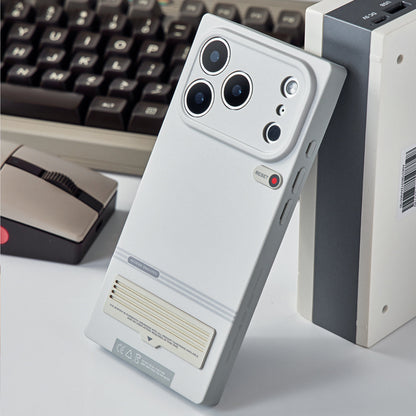 Retro terminal case standing beside a keyboard