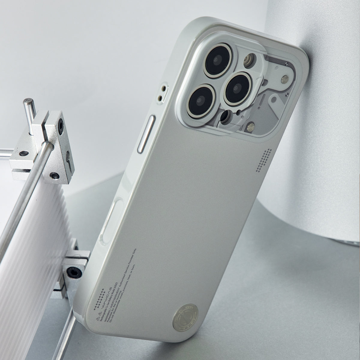 Chrome silver case side profile showing the metal buttons