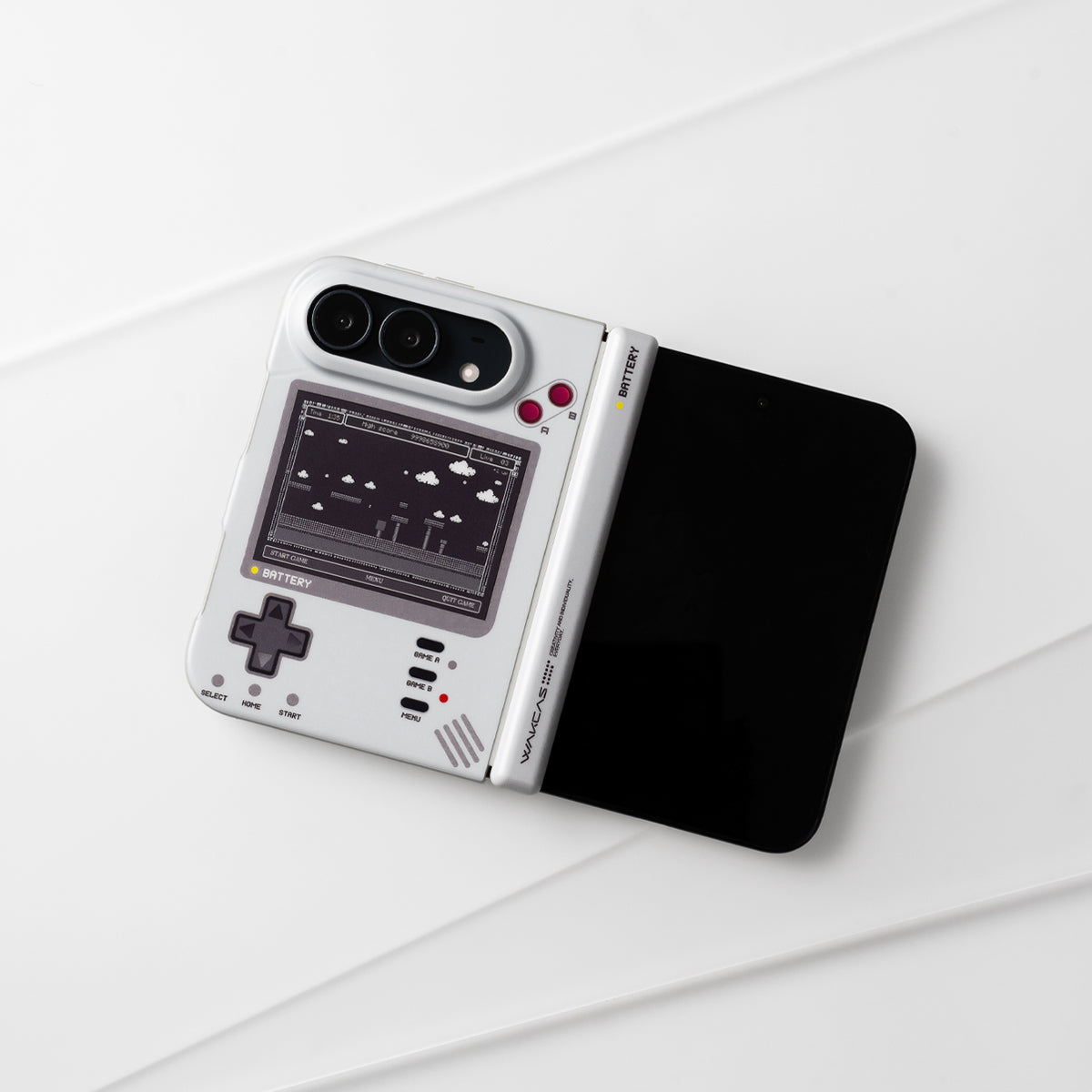 Unfolded iPhone Duo in the retro console case lying on a white surface