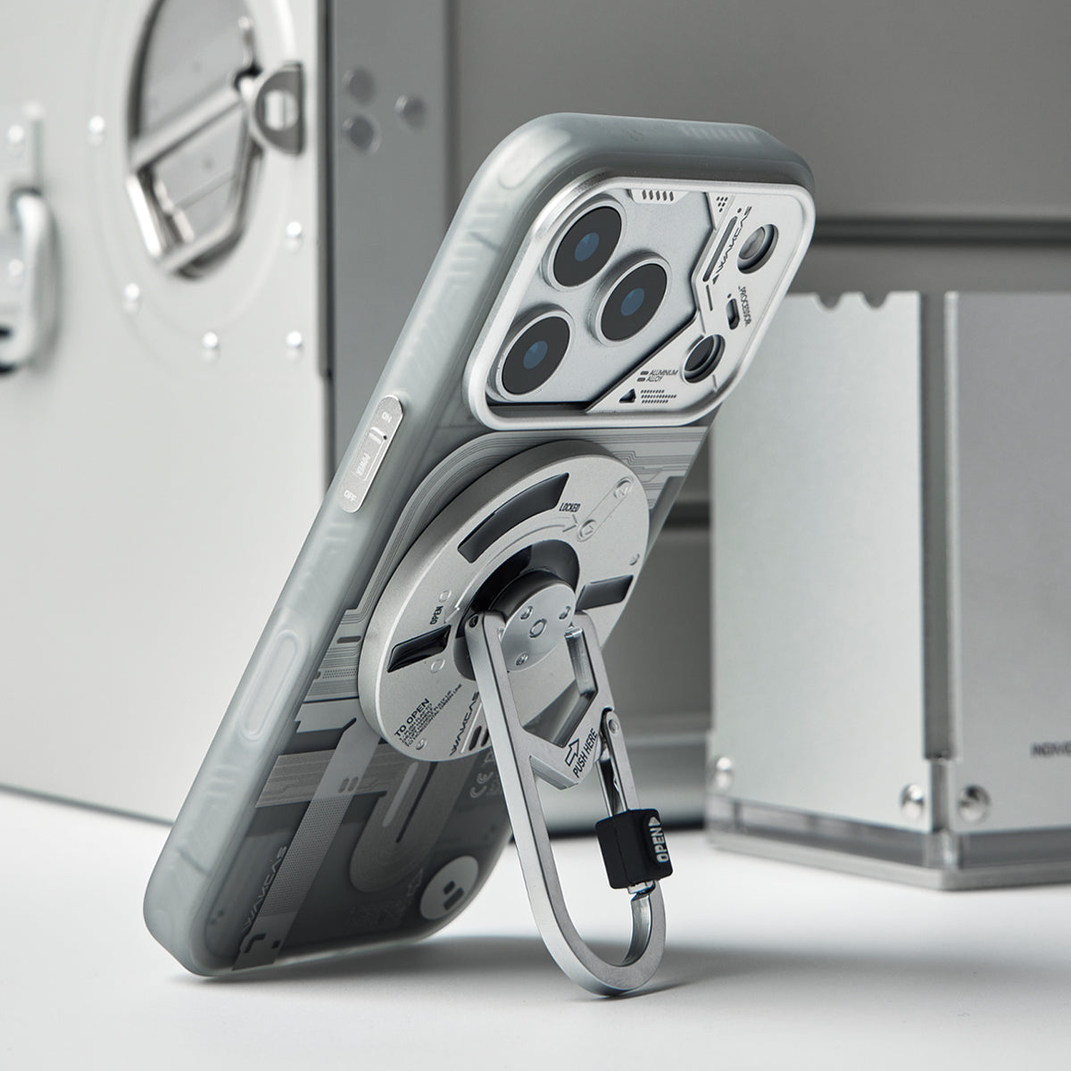 Frosted case propped up on its carabiner stand