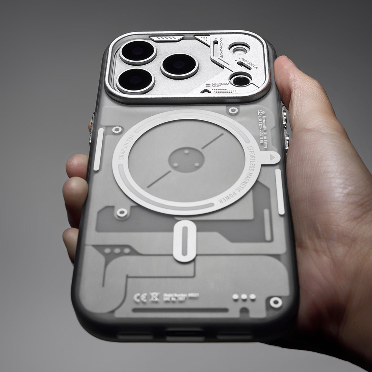 Hand holding the deep gray frosted case close up, showing the silver lens frame