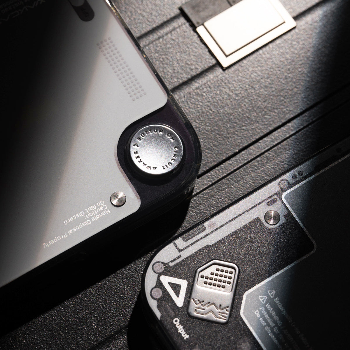 Close-up of metal badge detail on gloss see-through case