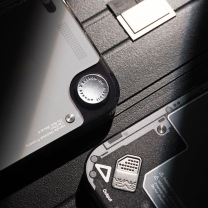 Close-up of metal badge detail on gloss see-through case