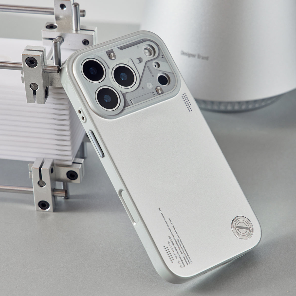 Chrome silver case propped against a metal frame