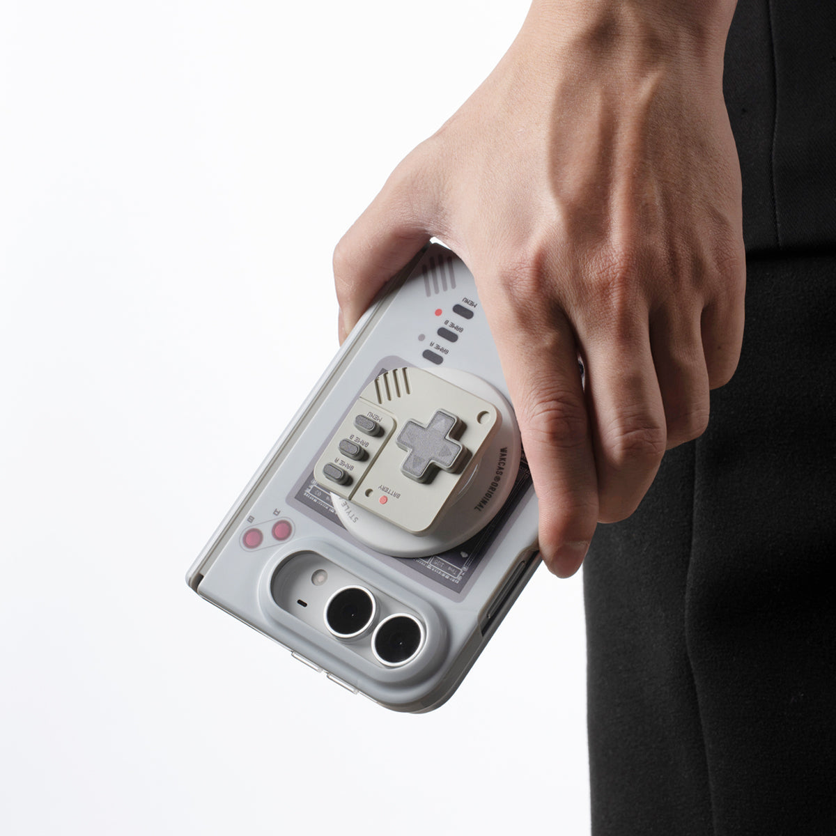 Hand carrying an iPhone Duo with the console-style magnetic stand on the back