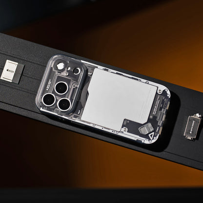 Black see-through case on an orange-lit surface