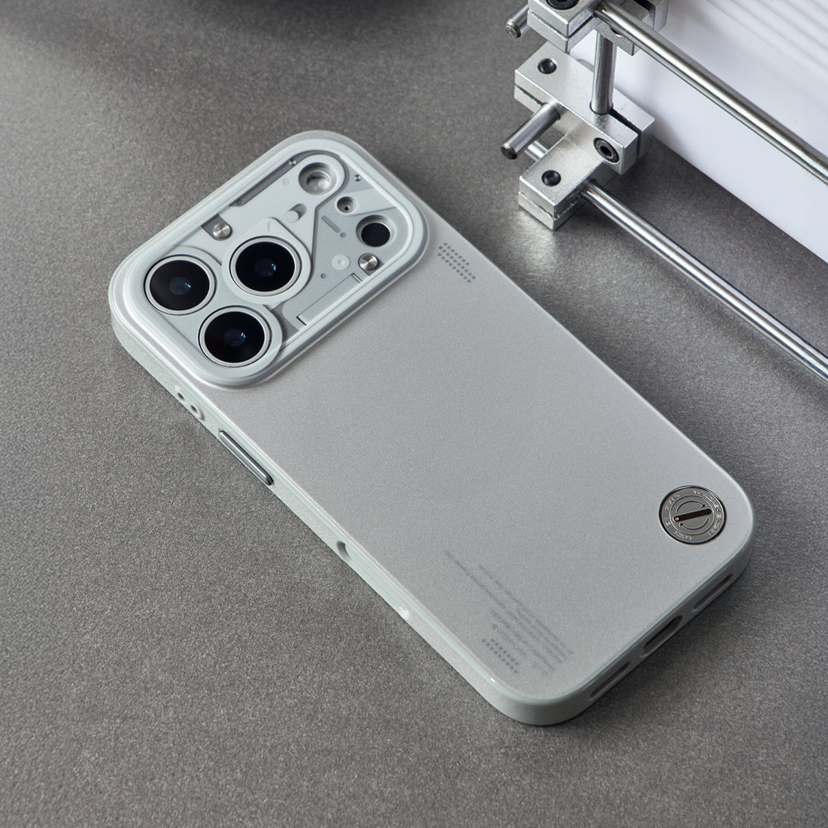 Chrome silver case lying on a gray surface