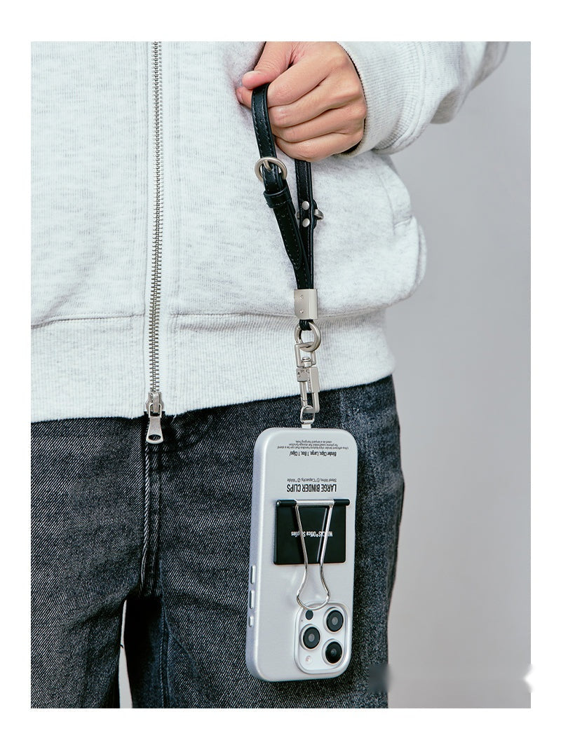 Person carrying the binder clip case on a black wrist strap