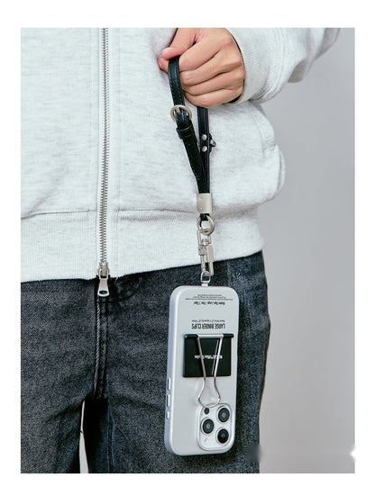Person carrying the binder clip case on a black wrist strap