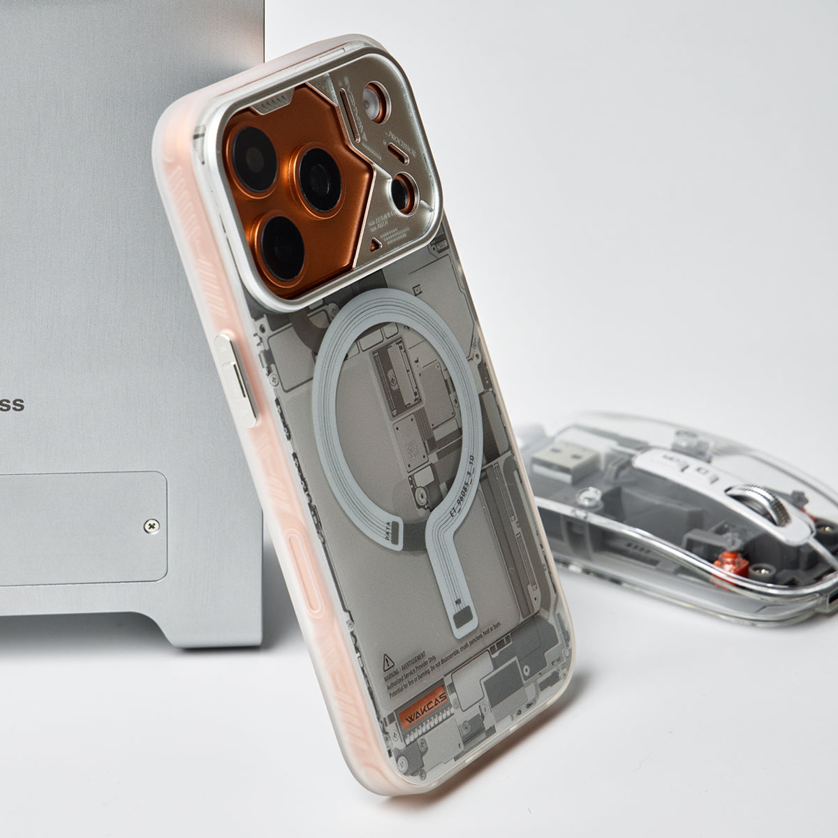 Grey circuit board case on an orange iPhone, side angle