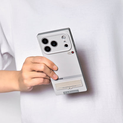 Hand holding the case against a white shirt