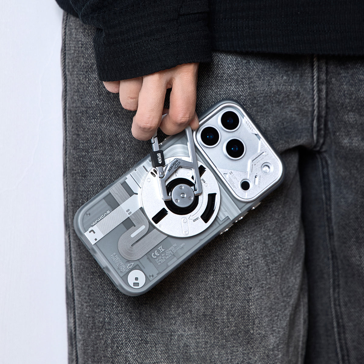 Hand carrying the phone by the carabiner stand loop
