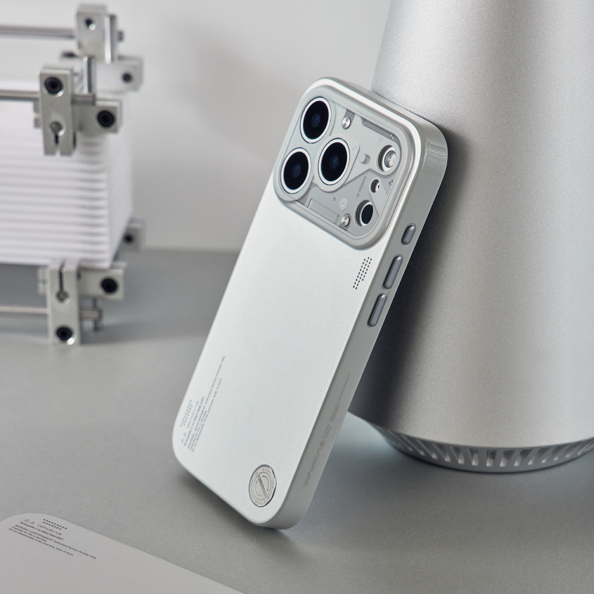 Chrome silver case leaning on a white lamp base