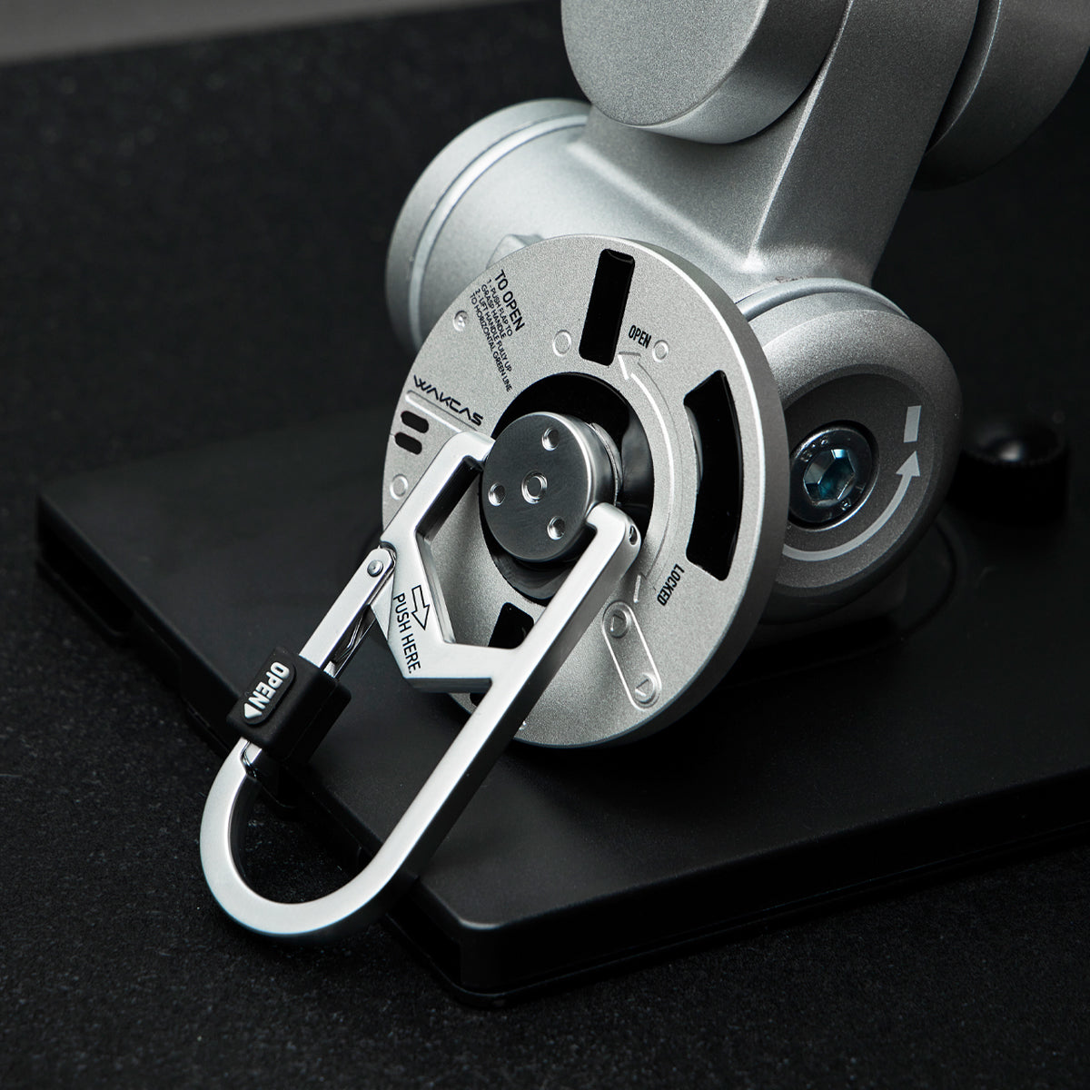 Round magnetic stand close-up with carabiner loop