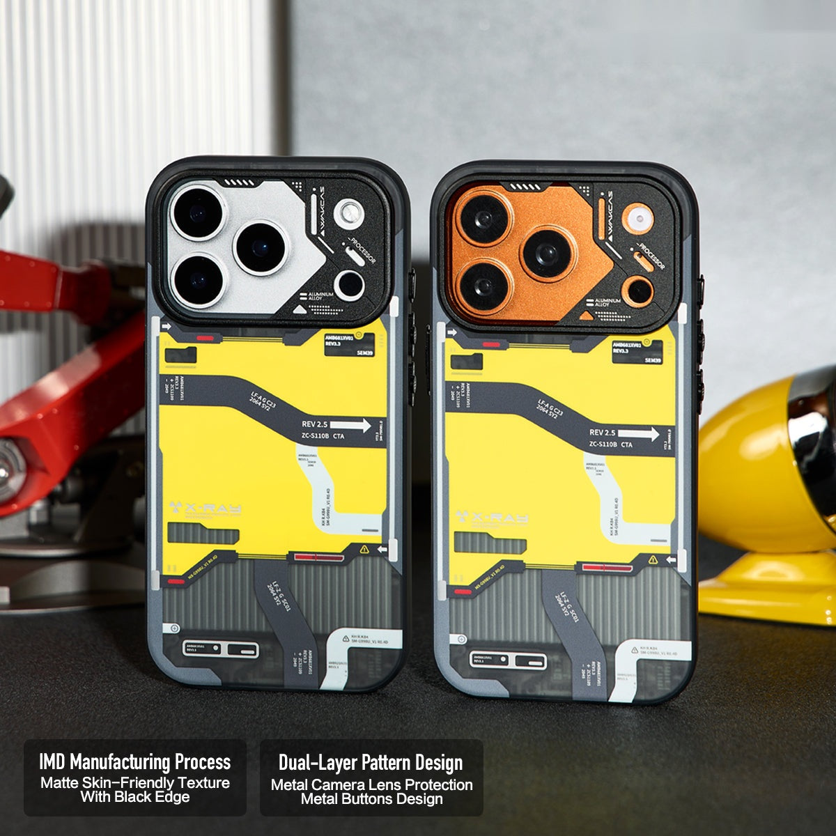Two tactical map cases with silver and orange metal camera rings on a desk