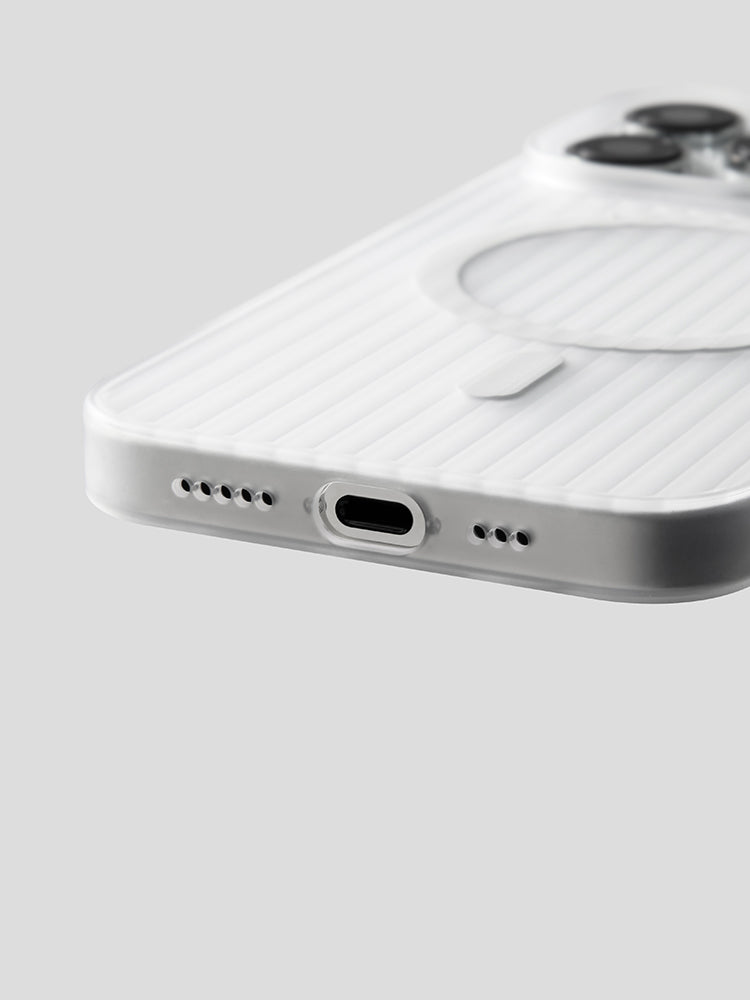Close-up of the bottom edge and port cutout of a white striped iPhone case