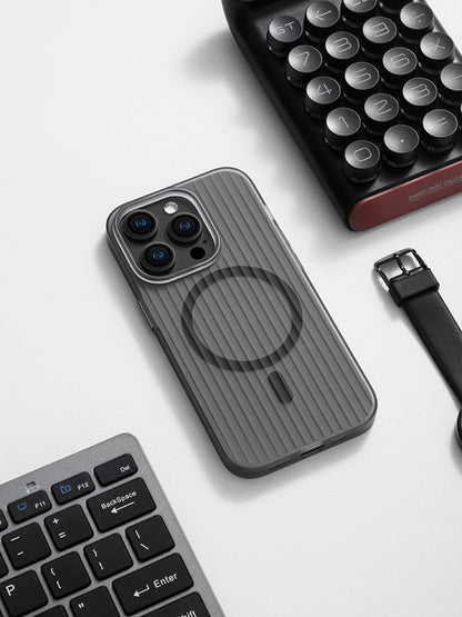 Black striped MagSafe iPhone case on a desk next to a keyboard