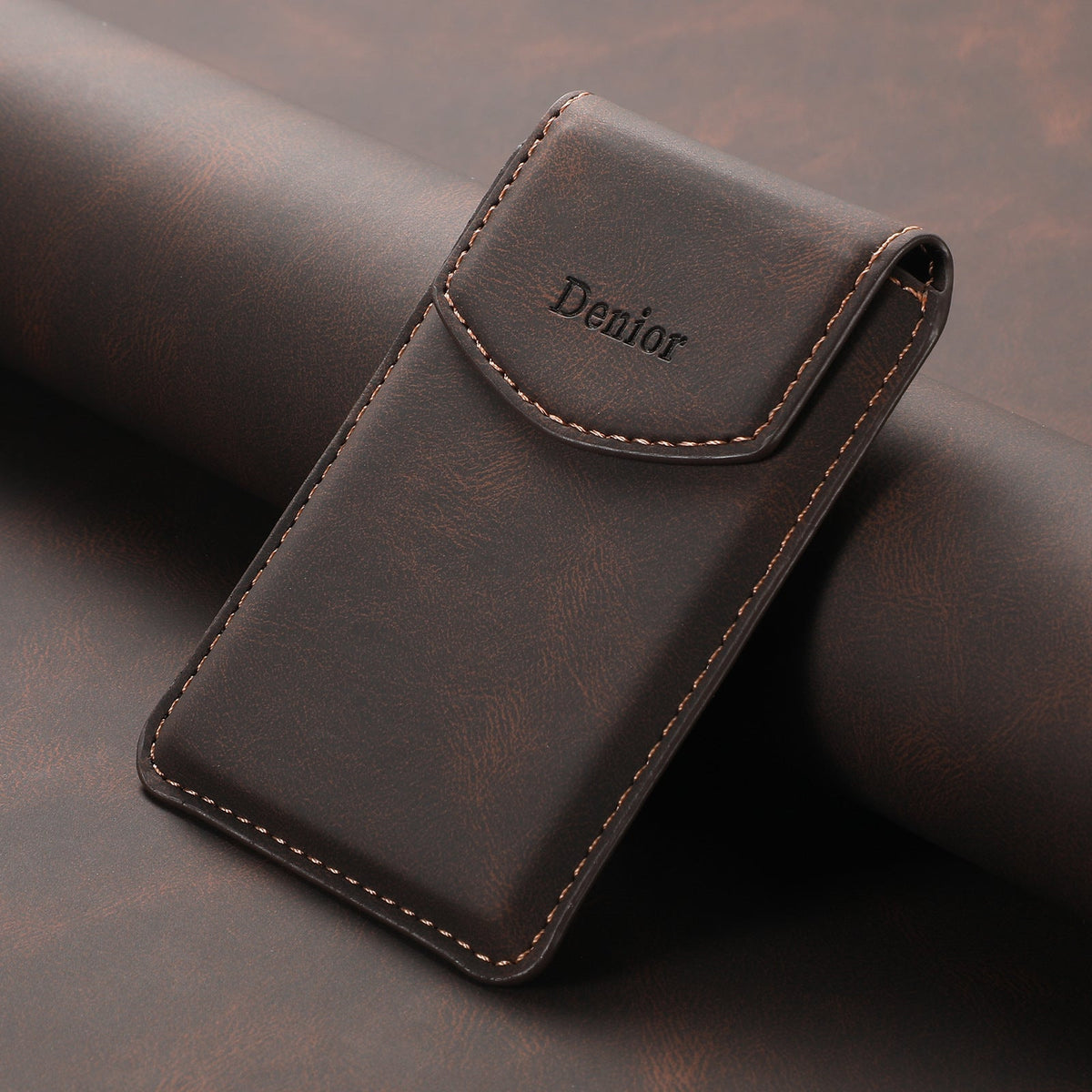 Close-up of the brown leather-look card holder flap and stitching