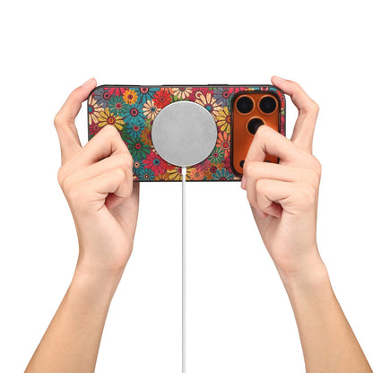 Floral case with the wallet removed, held over a round magnetic charging pad