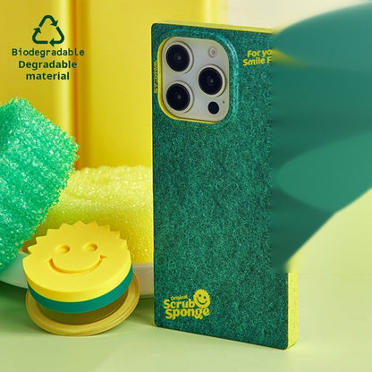 Sponge-print case styled next to green sponges and the smiley magnetic stand