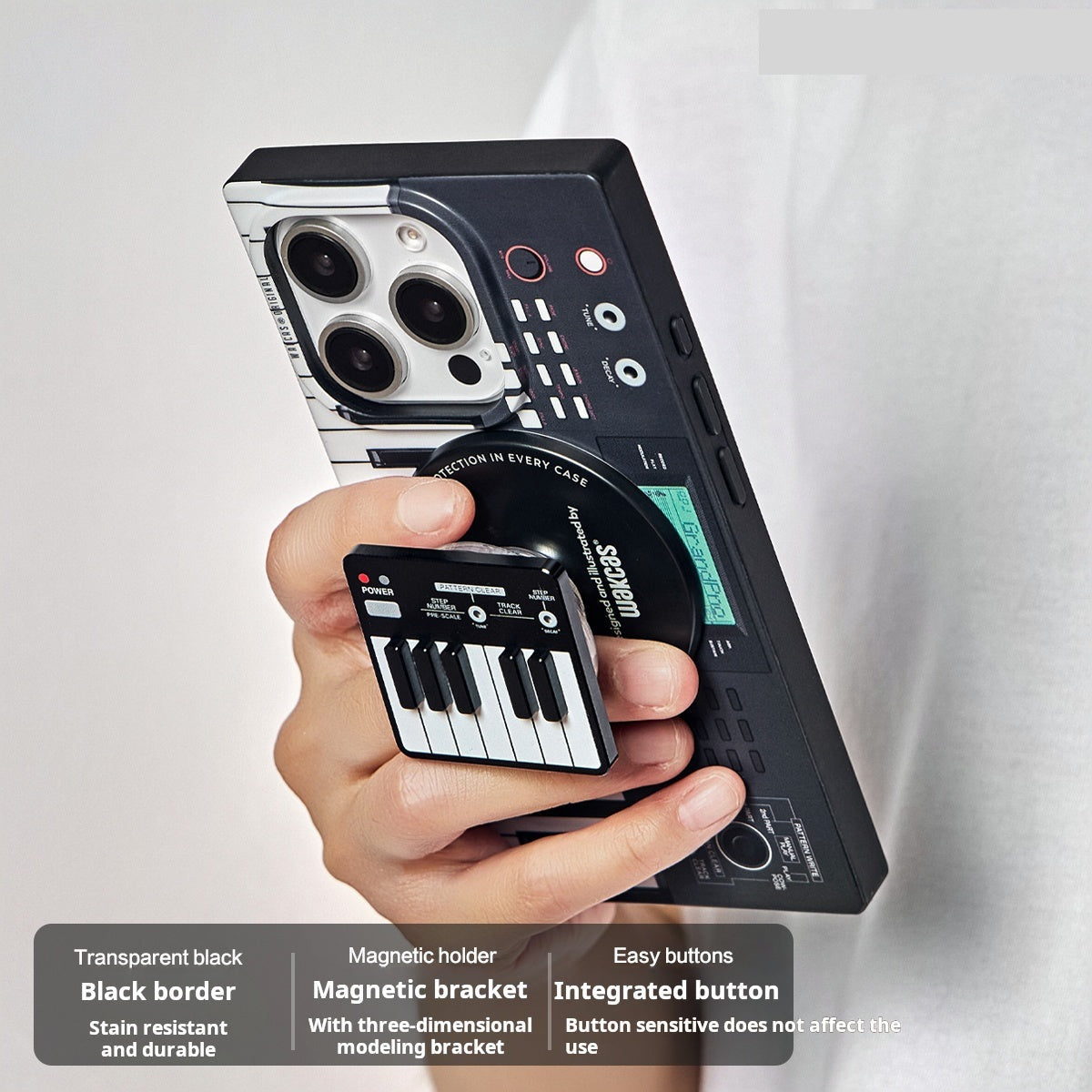 Hand holding the black piano-key case with the piano stand attached