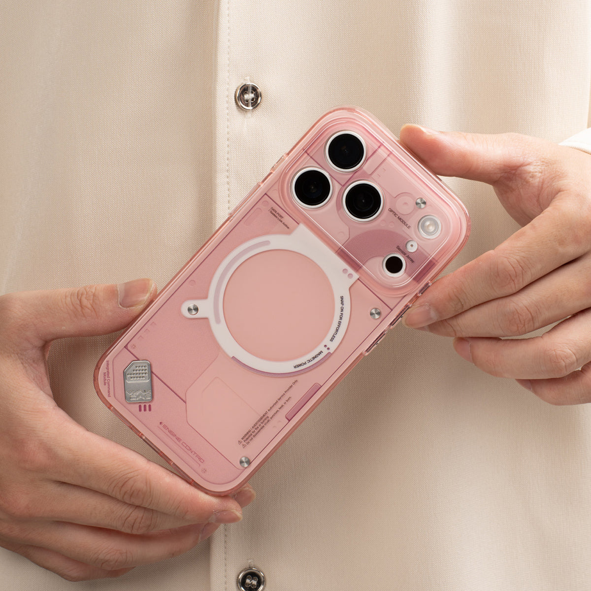 Hands holding the pink glossy MagSafe case