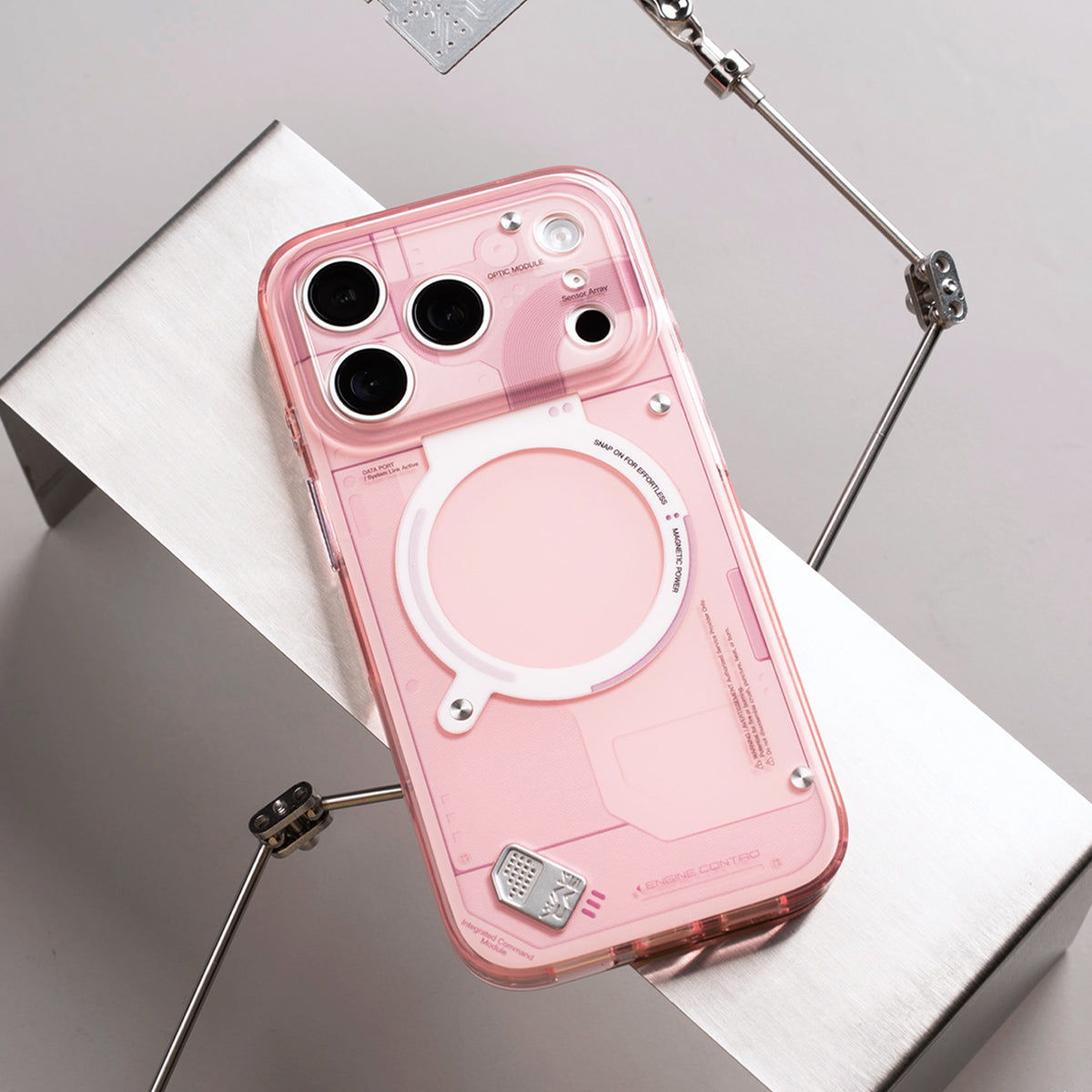 Pink glossy case propped on a silver block