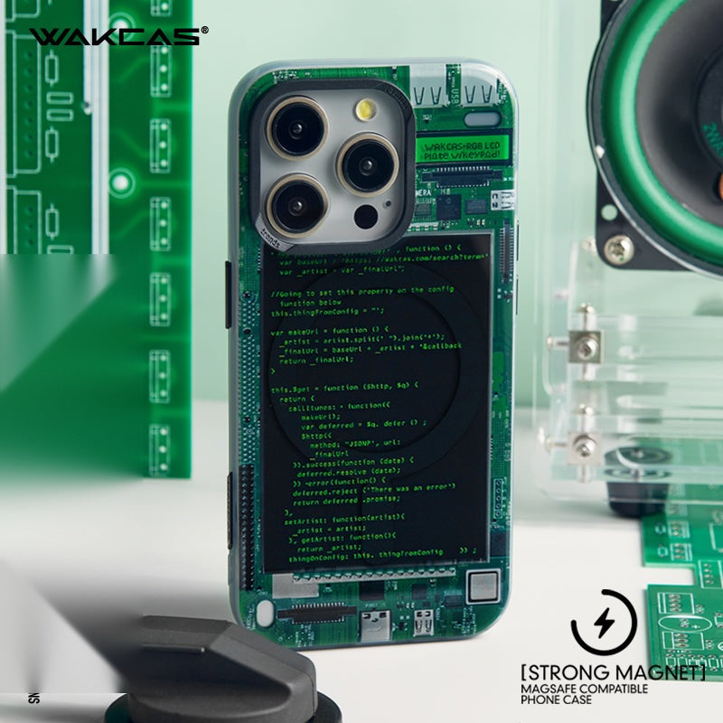 Green circuit board case lying on a desk beside circuit boards