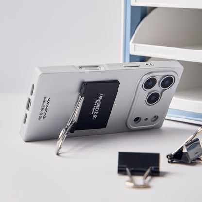 Silver case propped up on its binder clip kickstand