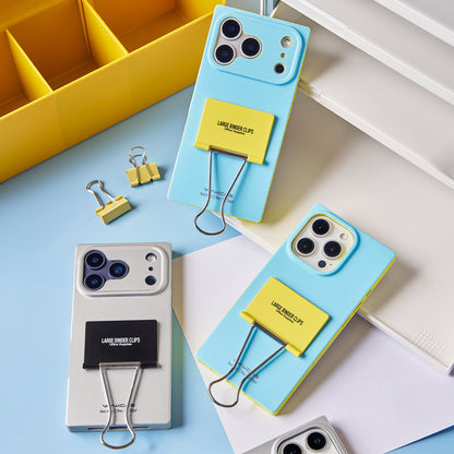 Blue and silver binder clip cases with desk props