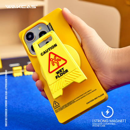 Hand holding the yellow case with the wet-floor stand attached