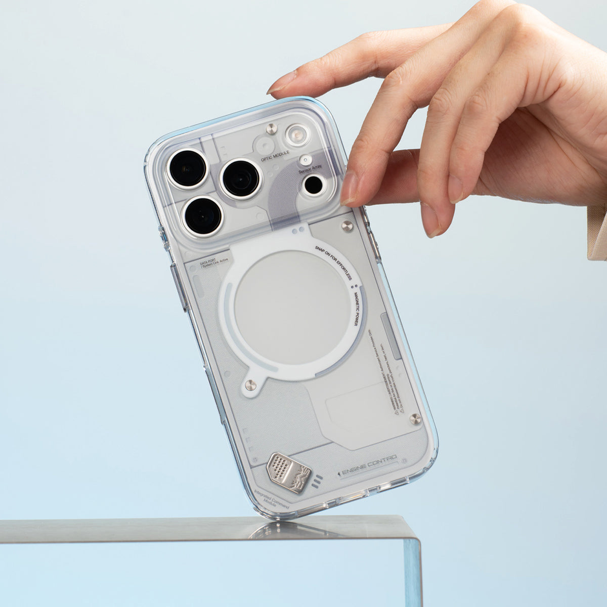 Light gray glossy case held at the corner
